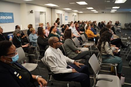 CHA Staff attend an internal presentation on new policies 